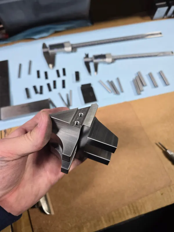 Complex precision machined aluminum component with threaded features produced by Olympus Machining